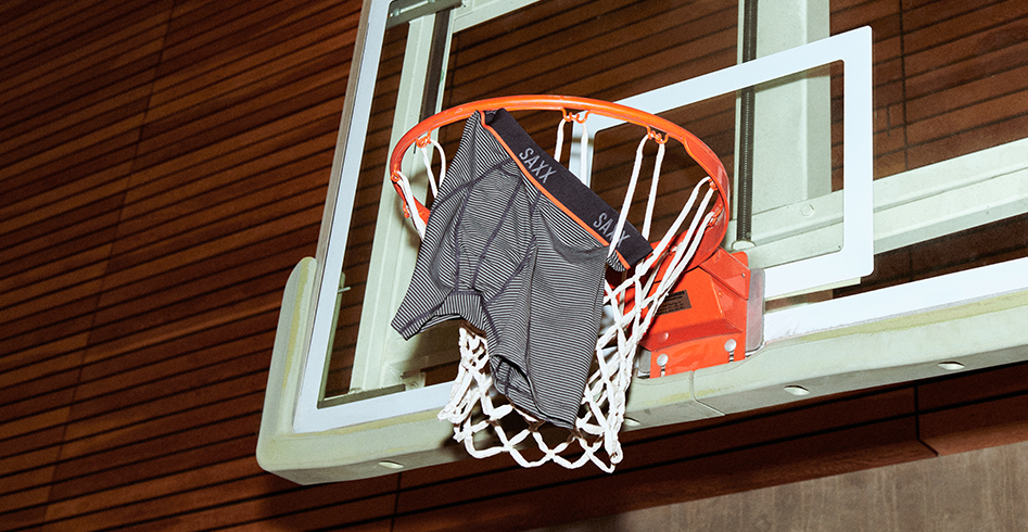 A pair of Kinetic HD Boxer Briefs hanging from a basketball hoop.