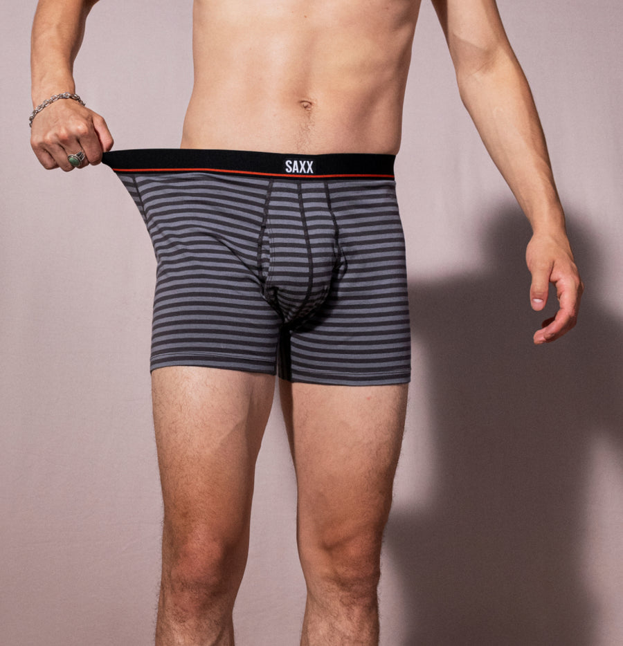 Man wearing gray boxer briefs in striped pattern