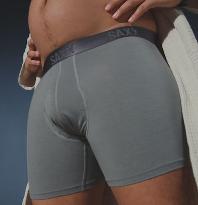 Man wearing gray silk blend boxer briefs and white robe